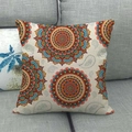Close-up of bohemian mandala patterns on textured linen throw pillow cover on grey sofa - Off-White Gorgeous Mandala Wheel Pattern (14)