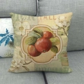 Detail of linen pillowcase with red apple and floral print on a grey fabric sofa - Red Apple Flowers (8) / 18x18 Inch