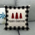 Close-up of linen Christmas pillowcase with buffalo plaid trees on a grey sofa - Retro Plaid Greetings (Style 13)