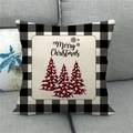 Close-up of Merry Christmas linen pillow cover with buffalo plaid trees on a grey sofa - Handwritten Script Plaid Tree (Style 11)