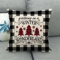 Detail of Christmas buffalo plaid linen pillow cover on a grey fabric sofa - Winter Wonderland Lettering (Style 10)