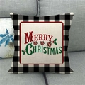 Detail of Christmas linen pillowcase with buffalo plaid border on a gray sofa - Poinsettia Merry Christmas Lettering (12) / 45x45cm