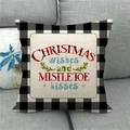 Detail of linen Christmas pillow case with buffalo plaid and festive quote on gray sofa - Christmas Wishes Mistletoe Kisses (11) / 45x45cm