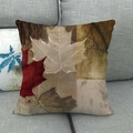 Close-up of linen pillowcase with autumn maple leaf pattern on a grey fabric sofa - Vintage Realistic Multicolored Maple Leaf (15)