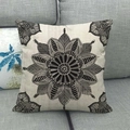 Detail of square linen pillowcase with grey geometric mandala pattern on a sofa - Black and Gray Symmetrical Mandala (6) / 45x45cm