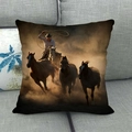 Detailed view of horse oil painting pillowcase on a grey sofa with warm lighting - American Western Cowboy Riding Horse (11)