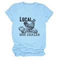 Detail of light blue cotton T-shirt featuring a vintage rooster and egg dealer graphic - Light Blue (Black Text)