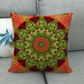 Bohemian geometric linen cushion cover with colorful mandala pattern on a sofa - Orange Green Kaleidoscope Geometric (6)