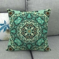 Close-up of geometric mandala linen pillowcase on a grey sofa with bohemian texture - Turquoise Ethnic Style (13)