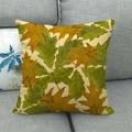 Linen pillowcase with autumn oak leaf pattern in green and gold on a gray sofa - Pastoral Oak Leaf Pattern (6) / 45x45cm