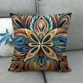 Böhmischer Kissenbezug mit Mandala-Muster in Orange und Blau auf grauem Sofa - Buntes Abstraktes Mandala