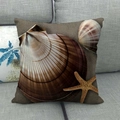 Linen pillow cover with ocean starfish and shell pattern on a grey fabric sofa - Brown Seastar Shell (8)