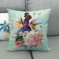 Close-up of tropical floral linen cushion with toucan and orchid patterns on a sofa - Light Blue Art Flowers Butterfly (6)