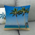 Detail of tropical palm tree watercolor print on linen pillowcase over a grey sofa - Full Color Beach View (11)