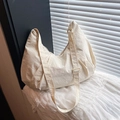 Minimalist cream crescent tote bag with adjustable strap and textured nylon fabric - White