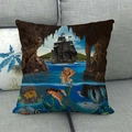 Detailed close-up of mermaid and pirate ship linen pillow cover on a grey sofa - Nautical Pirate Ship Fantasy Style (9)