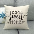 Detail of linen home sweet home pillowcase with floral design on a gray sofa - Bold Letters Symmetrical Leaves Style (14) / 18x18 Inch