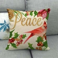 Dettaglio della federa natalizia in lino con uccelli rossi e scritta Peace dorata - Pettirosso e Testo Peace / 45x45 cm