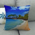 Detalle de la funda de cojín de lino con pintura de playa sobre un sofá gris - Óleo de Costa Tropical (10) / 45x45cm