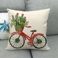 Close-up of linen pillowcase with watercolor red bicycle and cactus pattern on grey sofa - Red Bicycle with Cactus (Style 4)