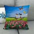 Close-up of a sunflower field linen pillowcase displayed on a grey fabric sofa - 45x45cm / Tulip and Butterfly Landscape (5)