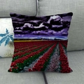 Detail view of sunflower linen pillowcase showing vivid tulip field print on a soft sofa - 45x45cm / Dark Red Tulip Cloud Landscape (14)