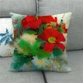 Linen Christmas pillow case with red poinsettia floral print on a grey fabric sofa - Poinsettia Floral Style (7)