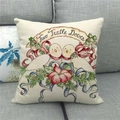 Linen Christmas pillow case with Two Turtle Doves print on a gray fabric sofa - Doves in Forest Style (14)