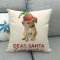 Detail of Christmas dog linen pillowcase with Dear Santa text on a grey fabric sofa - Dog with Elf Hat (15)