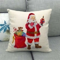 Macro detail of linen Christmas pillowcase featuring watercolor Santa Claus on a gray sofa - Santa with Paintbrush (11)