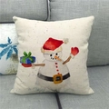 Detail of linen Christmas snowman pillow cover featuring watercolor art on a sofa - Watercolor Xmas Snowman (10)