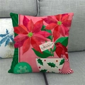 Weihnachts-Kissenbezug aus Leinen mit roten Weihnachtssternen und Vogel auf dem Sofa - Rosa Hintergrund Rotkardinal Blumenstil