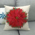 Linen Christmas pillowcase featuring red poinsettia and green leaves on a grey sofa - Red Christmas Flower (2)