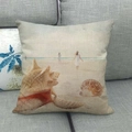 Detail of linen pillowcase featuring a realistic conch and shell beach scene on a grey sofa - 18x18 Inch / Realistic Conch Shell Style (14)