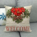 Détail d'une housse de coussin de Noël en lin avec texte Welcome et poinsettia - Style WELCOME sur Fond de Grain de Bois (10) / 45x45cm