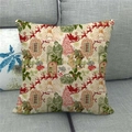 Detail van vintage kerstkussenhoes van linnen met rendier- en Noel-print op bank - Vintage Kerstmuziek Slee Patroon(3)