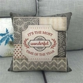 Detail of Christmas linen pillowcase with seasonal typography on gray sofa - Vintage Collage Pattern (8)