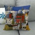 Christmas village linen cushion cover featuring red houses and snow on a grey sofa - Winter Red Residence (5)