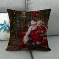 Detail of Christmas linen pillowcase featuring Santa Claus on a gray fabric sofa - Santa With Kids Pajamas (13) / 18x18 Inch