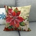 Poinsettia linen pillow case on grey sofa with Peace on Earth festive printing - Peace on Earth Poinsettia (15)