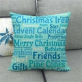 Close-up of linen Christmas pillowcase with festive typography on a grey fabric sofa - Teal Background Full Christmas Words (7) / 18x18 Inch