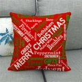 Detail of red Christmas linen pillowcase with festive typography on a gray sofa - Red Background Artistic Typography Christmas Words (8) / 18x18 Inch