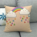Close-up of rainbow and smiling cloud print on a beige linen blend pillowcase - 18x18 Inch / Rainbow and Smiling Cloud