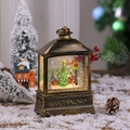 Vue détaillée de lanterne de Noël vintage en bronze avec neige et éclairage chaleureux - Non-rotatif-Maison dans l'arbre
