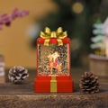 Detailopname van een kerstwaterbal met LED-verlichting, de kerstman en een rendier - Rode Kerstman op Rendier