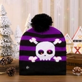 Close-up of LED glowing skull beanie with stripes and on-off switch detail - Skull Alien
