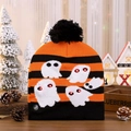 Close-up of LED Halloween beanie showing ghost patterns and the manual power switch - Ghost Style