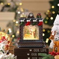 Dettaglio palla di neve natalizia a camino con Babbo Natale e glitter scintillanti - Babbo Natale