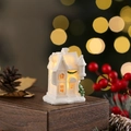 Macro detail of white resin house with snow texture and warm LED glowing inside - Style H (White 101-H)