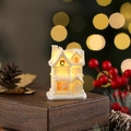 Close-up of white resin Christmas house with warm LED light and snow texture - Style G (White 101-G)